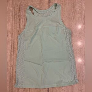 Lululemon mint green top with pocket and anti-stink silverescent thread, size 8